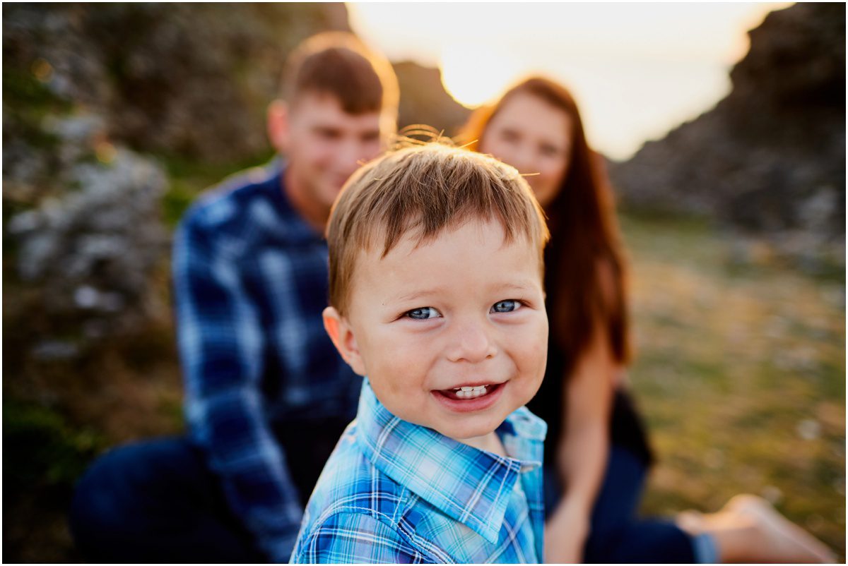 little boy with dimples in family portrait 