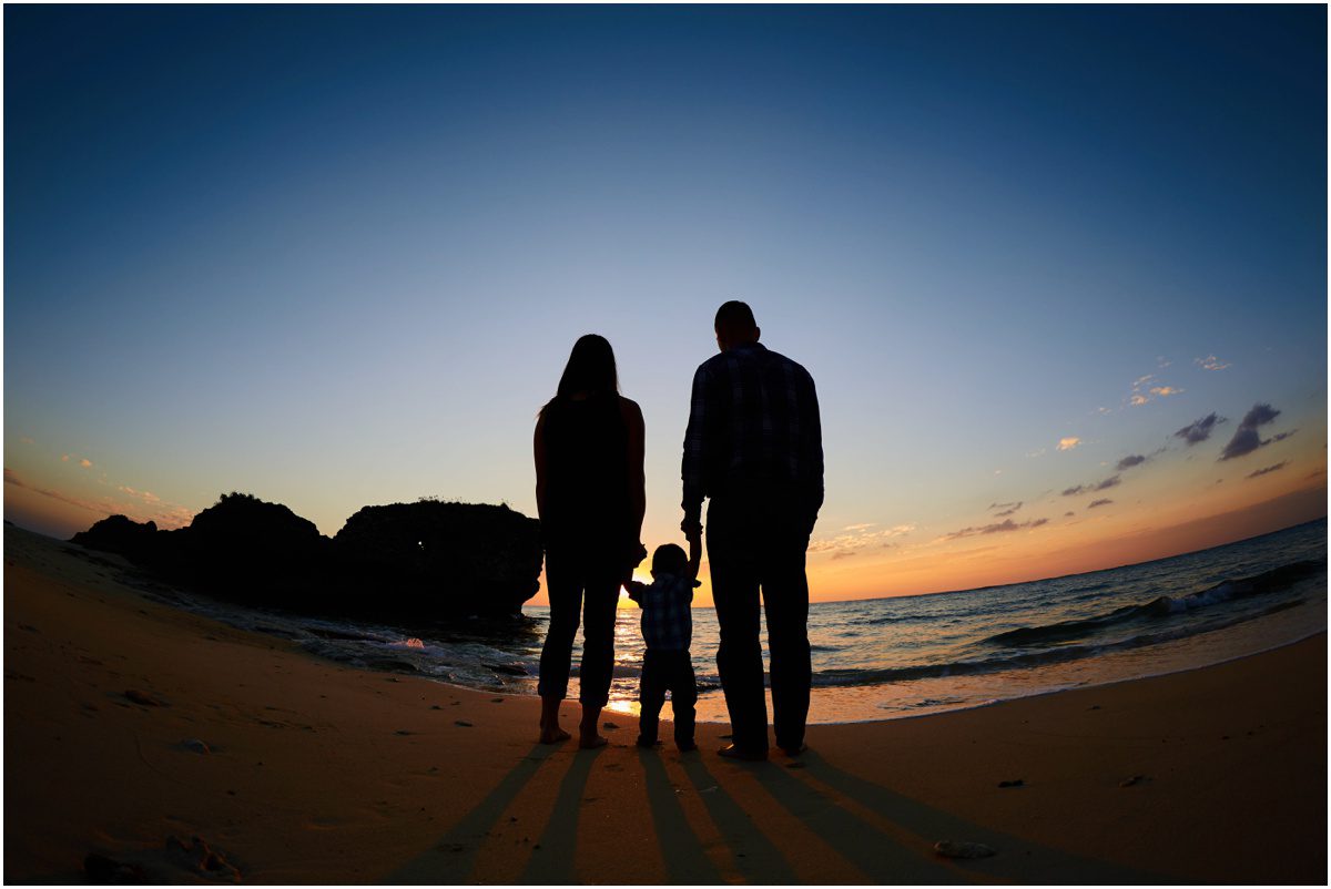 family portrait silhouette on the beach