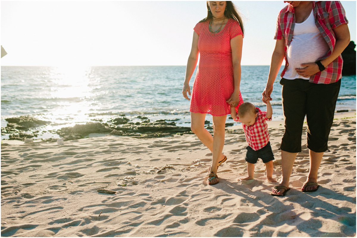 Okinawa Beach Maternity Photographer child looking at sand