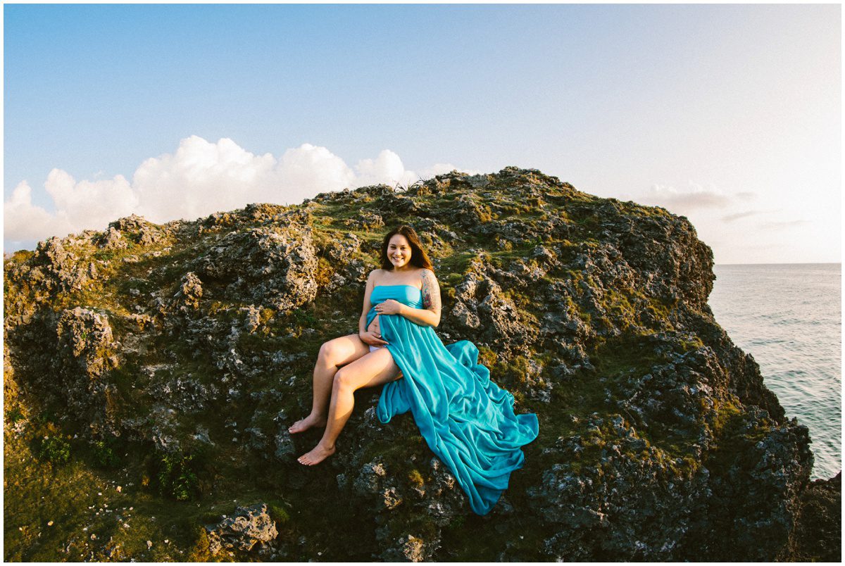 natural-light-beach-maternity on a rock in a dress