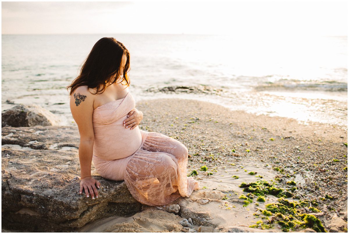 natural-light-beach-maternity looking at belly