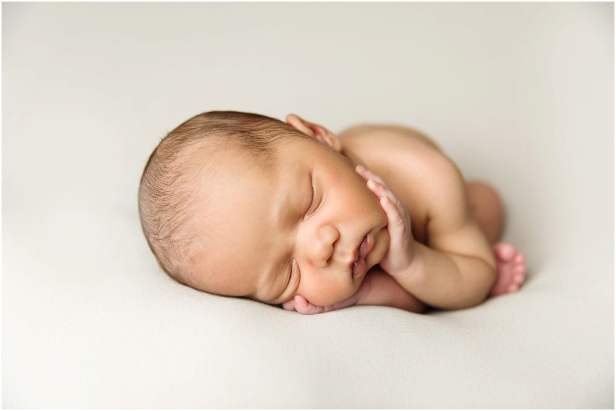 orange-studio-newborn-photographer womb pose