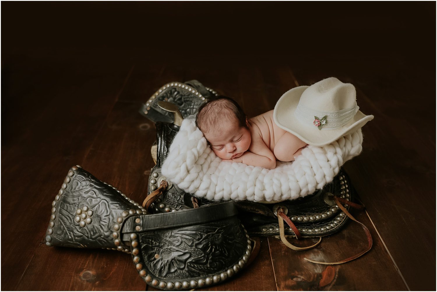 Baby on Saddle Orangeville, PA Newborn Photographer
