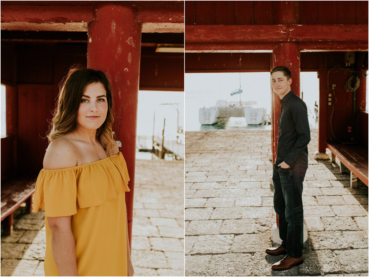 couples standing by red building Engagement Photographer in Bloomsburg, PA