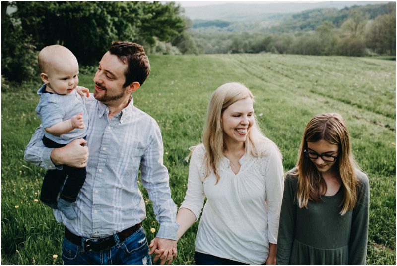 family photo in grassy field, Beautiful Spring Family Portraits in Bloomsburg, Pennsylvania, mountain location