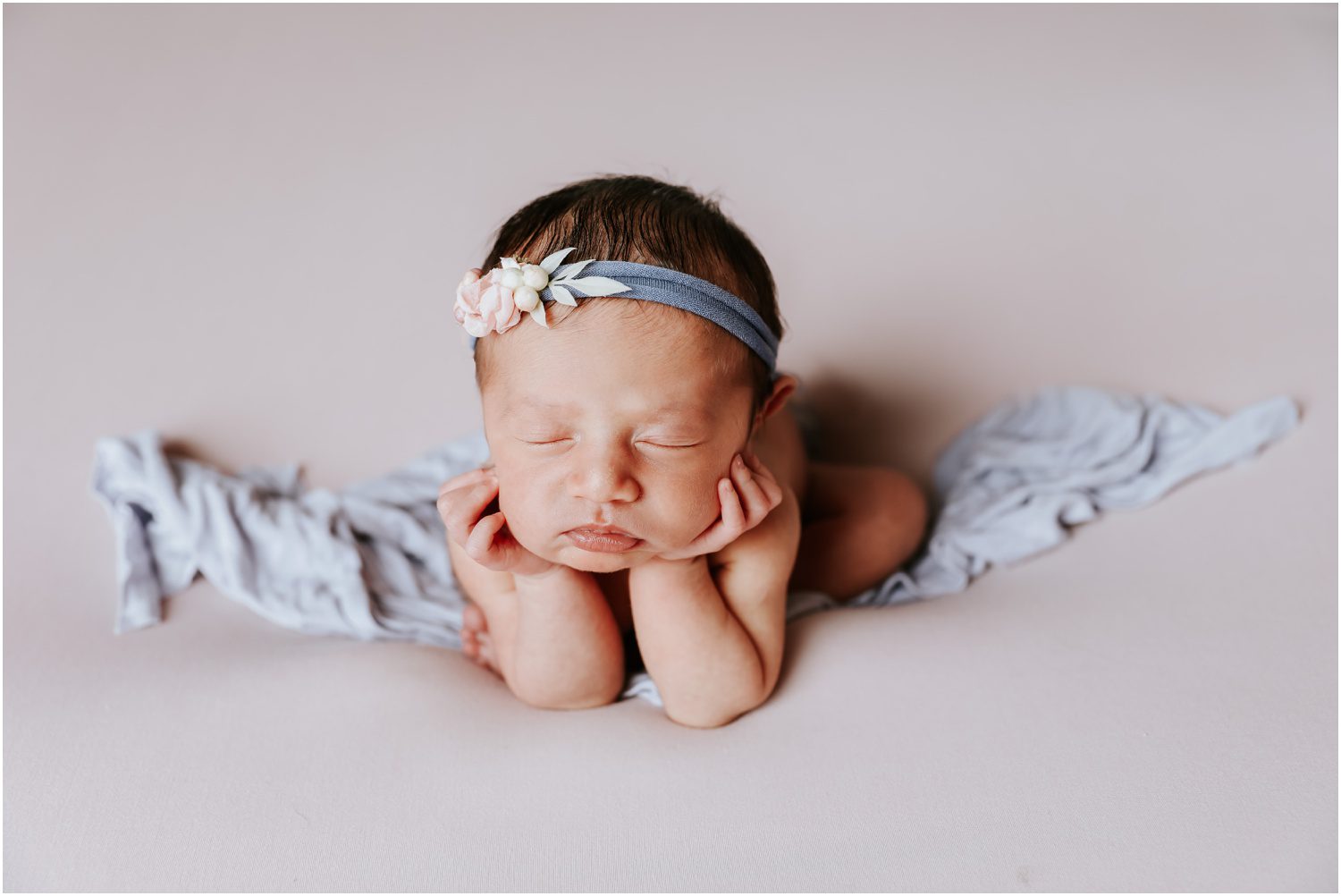 NEPA Studio Newborn Photographer , baby holding head in hands