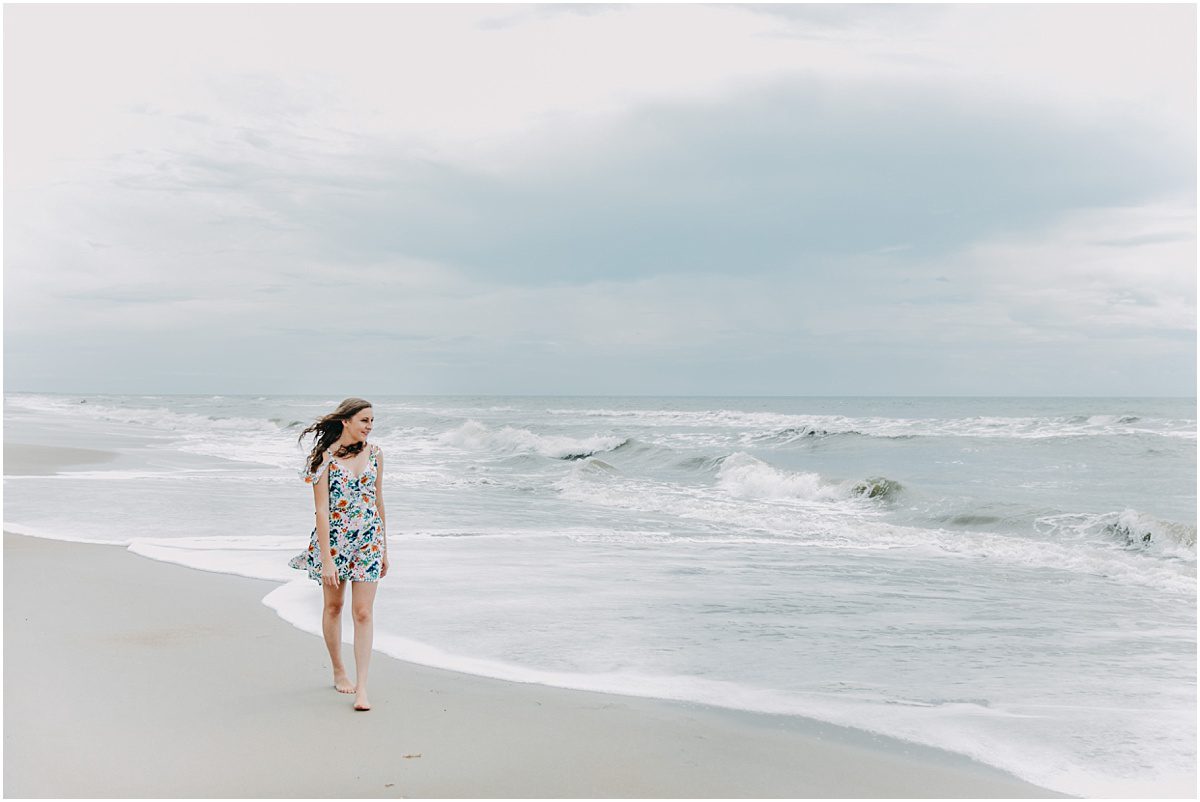 walking on the beach as a senior in high school, Onslow Beach, NC Senior Photographer