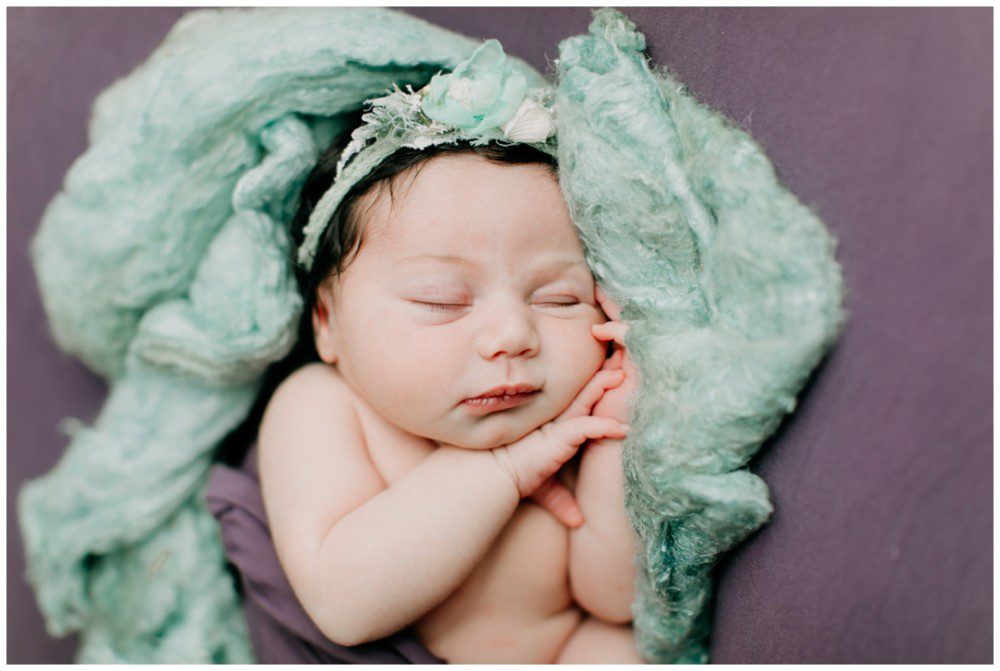 Catawissa Newborn Photographer, baby girl portraits, Pennsylvania newborn photographer, baby girl laying down on green blanket fluff