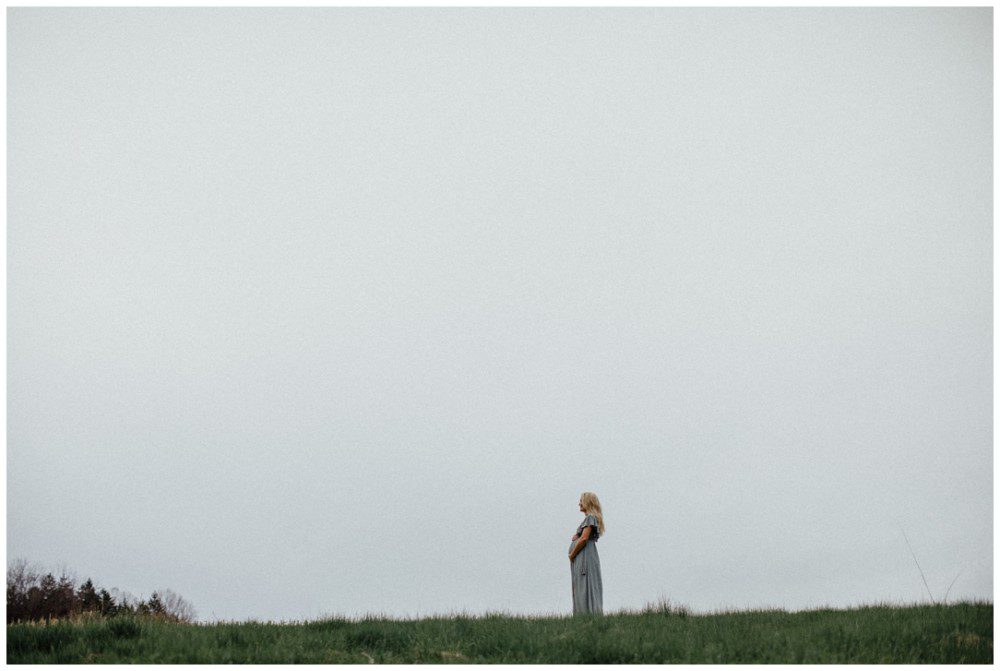 Catawissa Outdoor Maternity Photographer, pregnant woman standing on a hill, negative space