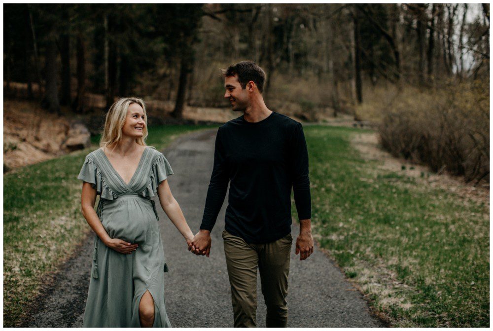 Catawissa Outdoor Maternity Photographer, pregnant woman walking in the woods with her husband